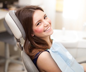 Smiling woman in dental chair