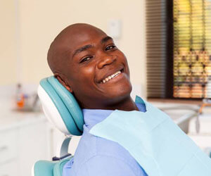 Smiling man in dental chair