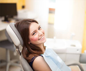 Smiling woman in dental chair