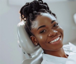 Female patients smiling in the dentist’s chair 