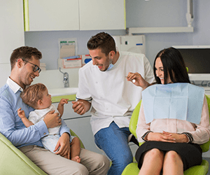 young family at dentist