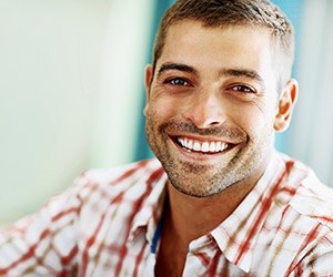 Young man with healthy teeth and gums