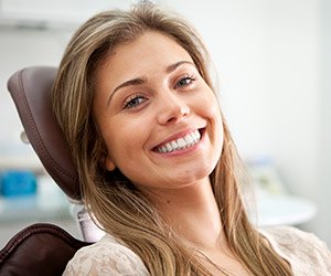 Smiling woman in dental chair