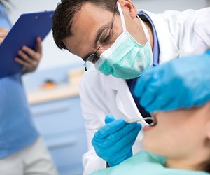 A dentist working on a patient.