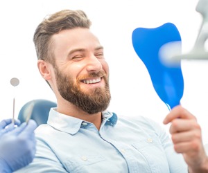 Portland teeth Whitening man looking at his bright white smile