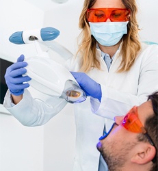 Man receiving in-office teeth whitening