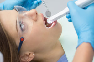 dentist using intraoral camera