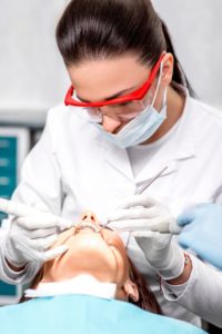 person receiving dental cleaning 