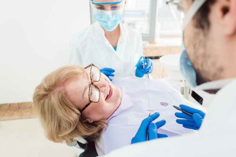 Dentist talking to patient about dental implants