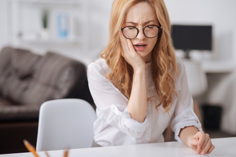 Woman with dental emergency