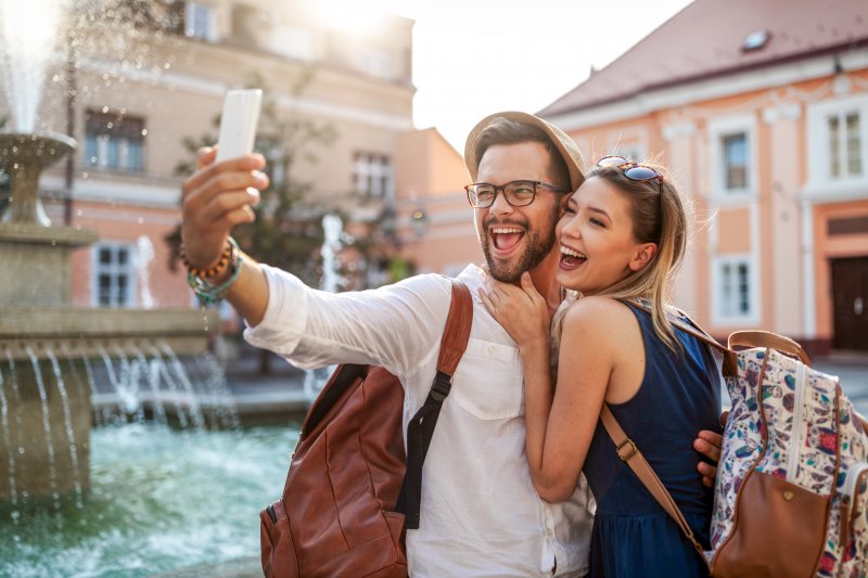 couple smiling on summer vacation