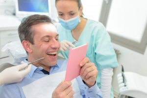 Man smiling after getting veneers to fix gaps